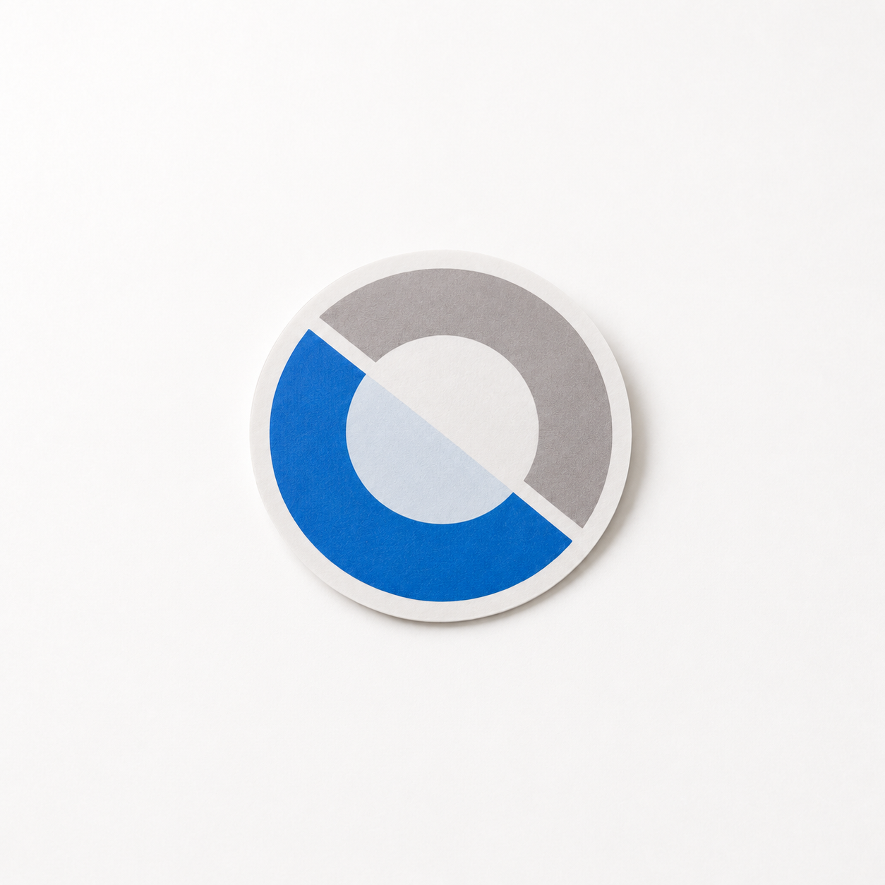 Front-facing product photo of the round Datawear sticker